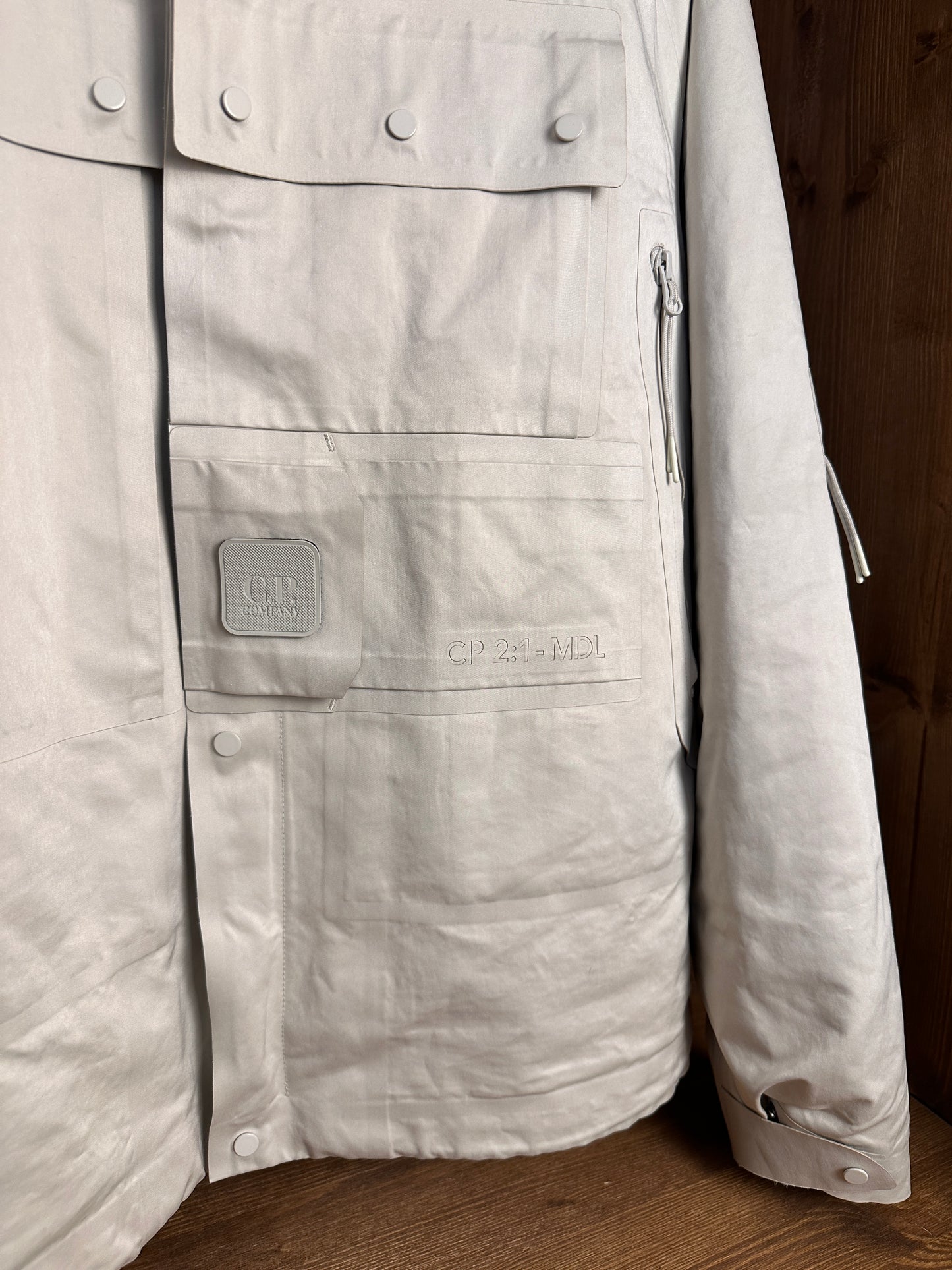 AW20s C.P. COMPANY A.A.C. DOWN JACKET in Oyster White